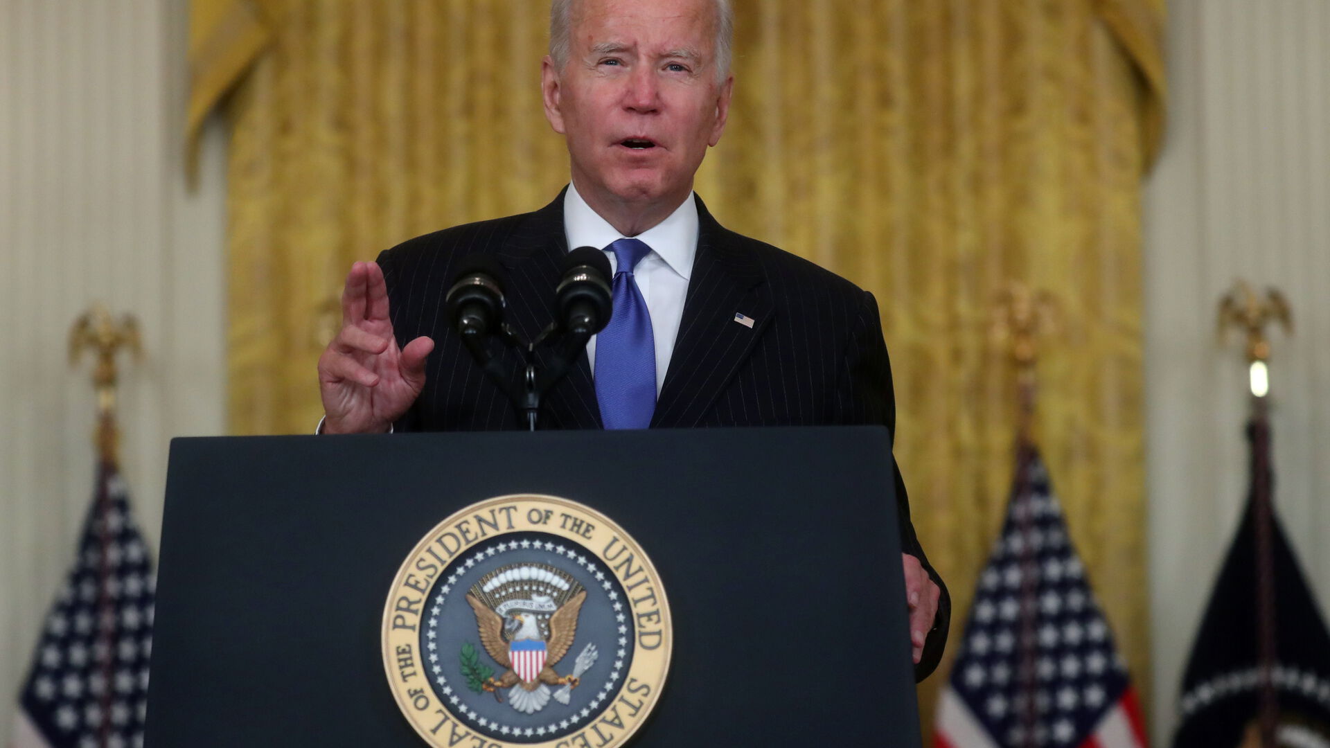 Biden vows to address supply chain bottlenecks, pain felt on both coasts