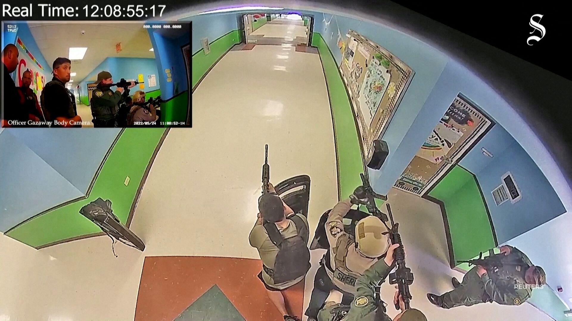 In newly released video, a surveillance camera captures the Uvalde school shooter entering the classroom where 19 children and two teachers died.