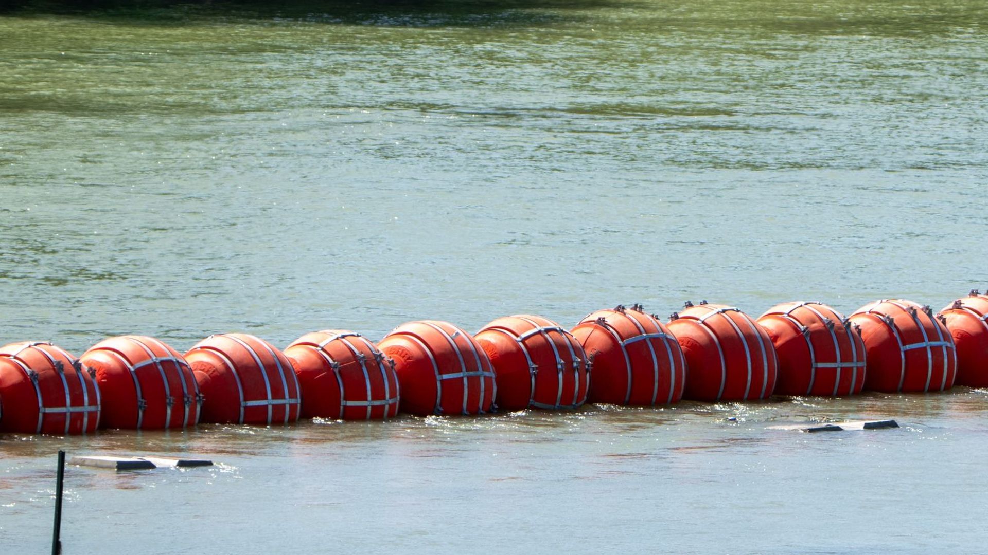 Mexico says Texas may be violating international law by installing a border wall made up of orange buoys in the middle of the Rio Grande.