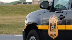 The Delaware State Police Department will pay a man $50,000 after ripping up his sign and citing him for improper hand signaling.