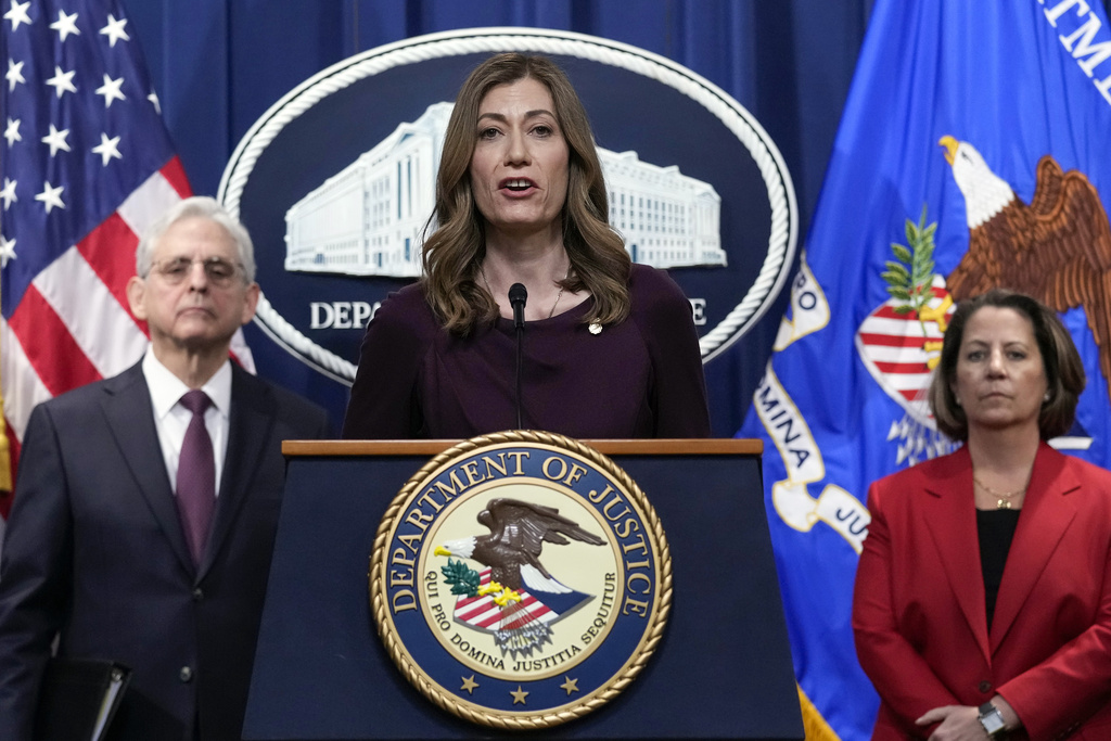 DEA Administrator Anne Milgram, center, flanked by Attorney General Merrick Garland, left, and Deputy Attorney General Lisa Monaco, right, speaks during a news conference at the Justice Department in Washington, Friday, April 14, 2023. 