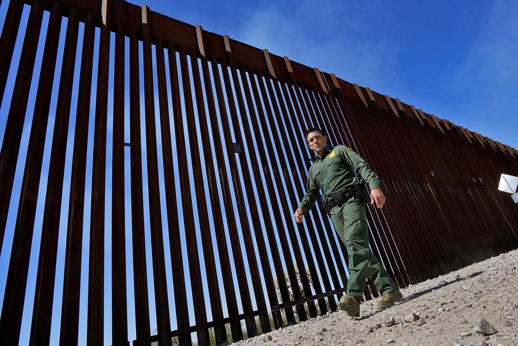 FILE - Border Patrol Deputy Chief for the Tucson Sector Justin De La Torre walks along the border fence of the U.S.-Mexico border, on Aug. 29, 2023, in Organ Pipe Cactus National Monument near Lukeville, Ariz. Most people in the U.S. see Mexico as an essential partner to stop drug trafficking and illegal border crossings, even as they express mixed views of Mexico's government, according to a new poll.(AP Photo/Matt York, File)