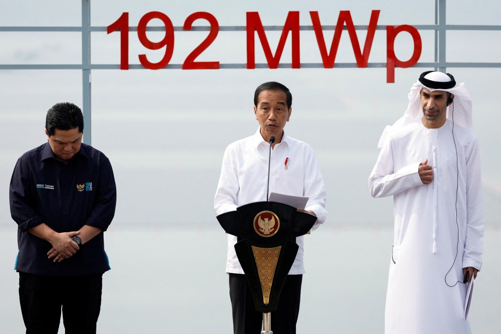 Indonesian President Joko Widodo delivers his speech as Indonesia's Minister of State Owned Enterprises Erick Thohir and UAE Minister of Foreign Trade Thani bin Ahmed Al Zeyoudi stand, during the inauguration of a 192 megawatt peak (MWp) floating solar power plant, that was built on Cirata dam and developed by PLN Nusantara Power, a unit of Indonesia's state utility company Perusahaan Listrik Negara (PLN) and United Arab Emirates renewable energy company Masdar, a unit of Mubadala Investment Company, in Purwakarta, West Java province, Indonesia, November 9, 2023. REUTERS/Willy Kurniawan