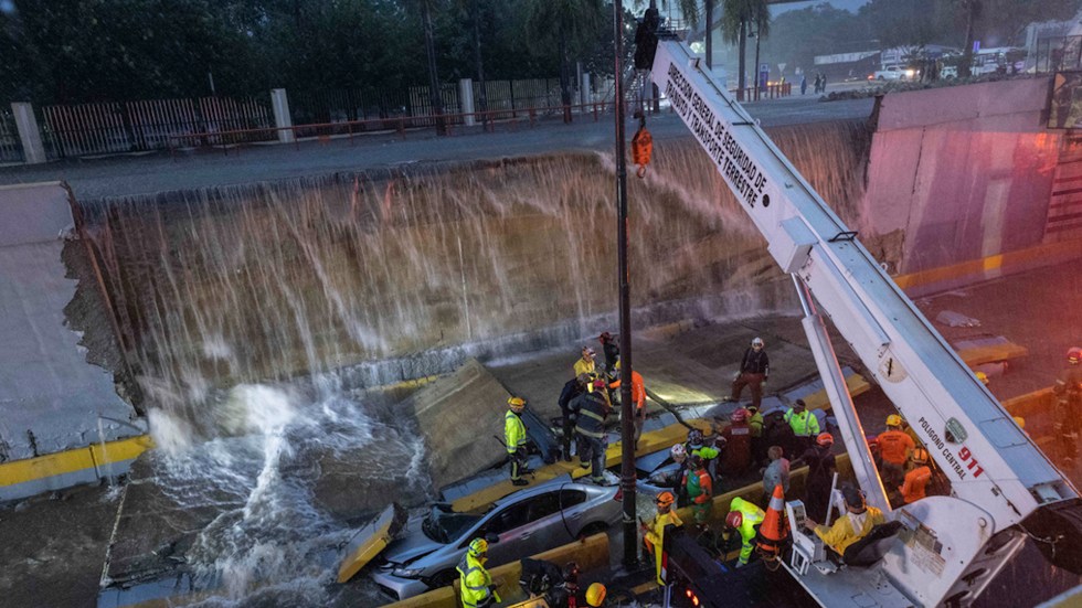 At least nine people died when a concrete wall collapsed in a tunnel on a busy avenue in Santo Domingo on Saturday. The incident is a result of heavy rains and floods caused by a tropical disturbance impacting the western Caribbean.