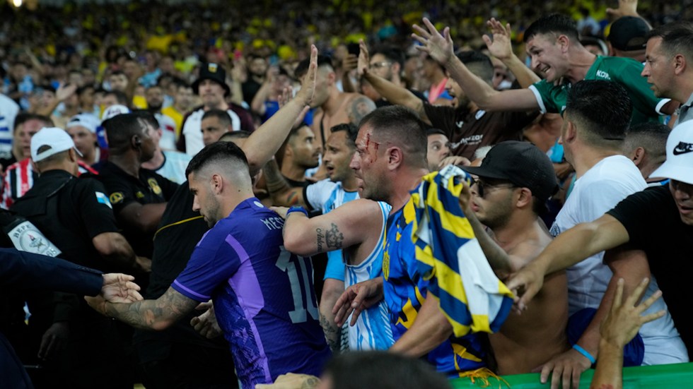 Violence erupted between Brazil and Argentina fans before a World Cup qualifier in Rio De Janeiro, resulting in police intervention.