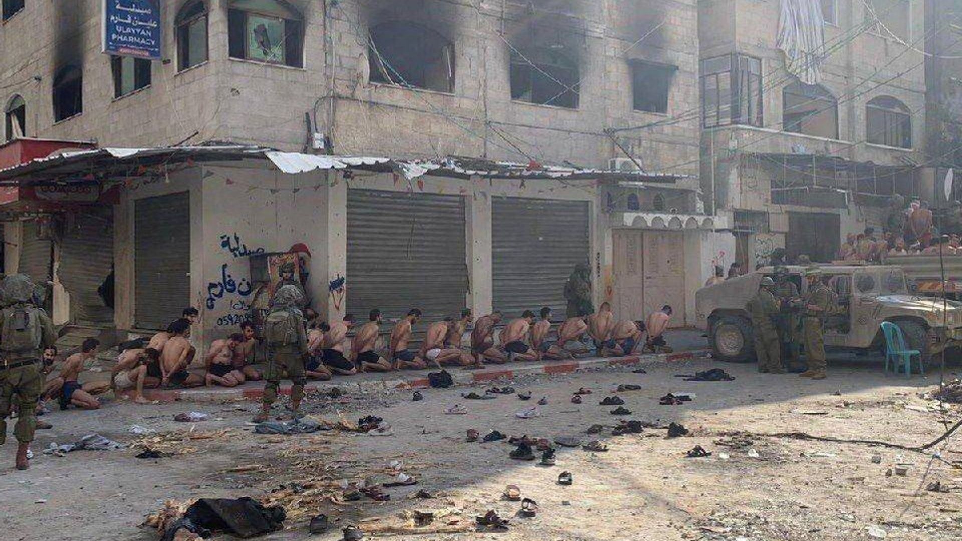 Images that allegedly show dozens of Hamas soldiers restrained wearing nothing but their underwear have ignited controversy.