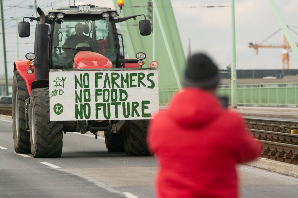 Hundreds of farmers from nearby communities are kicking off a week-long strike to protest against the government's plan to cut agricultural subsidies and are blocking roads in Cologne, Germany, on January 8, 2024. (Photo by Ying Tang/NurPhoto)NO USE FRANCE