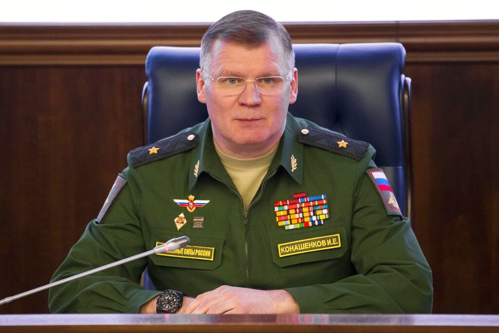 FILE - In this April 13, 2018 file photo, Russian Defense Ministry spokesman, Maj. Gen. Igor Konashenkov, speaks at a briefing in Moscow. Russia’s Defense Ministry says Israeli air forces nearly shot down a passenger jetliner in Syria during a missile strike on the suburbs of Damascus.  In a statement released Friday, Feb. 7, 2020, Konashenkov said the strike was carried around 2 a.m. local time Thursday. Israel did not respond to a request for comment. (AP Photo/Alexander Zemlianichenko, File)