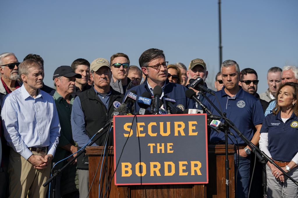 U.S. House Speaker Mike Johnson speaks while standing with Republican members of Congress, Wednesday, Jan. 3, 2024, in Eagle Pass, Texas. Johnson is leading about 60 fellow Republicans in Congress on a visit to the Mexican border. Their trip comes as they are demanding hard-line immigration policies in exchange for backing President Joe Biden's emergency wartime funding request for Ukraine. (AP Photo/Eric Gay)