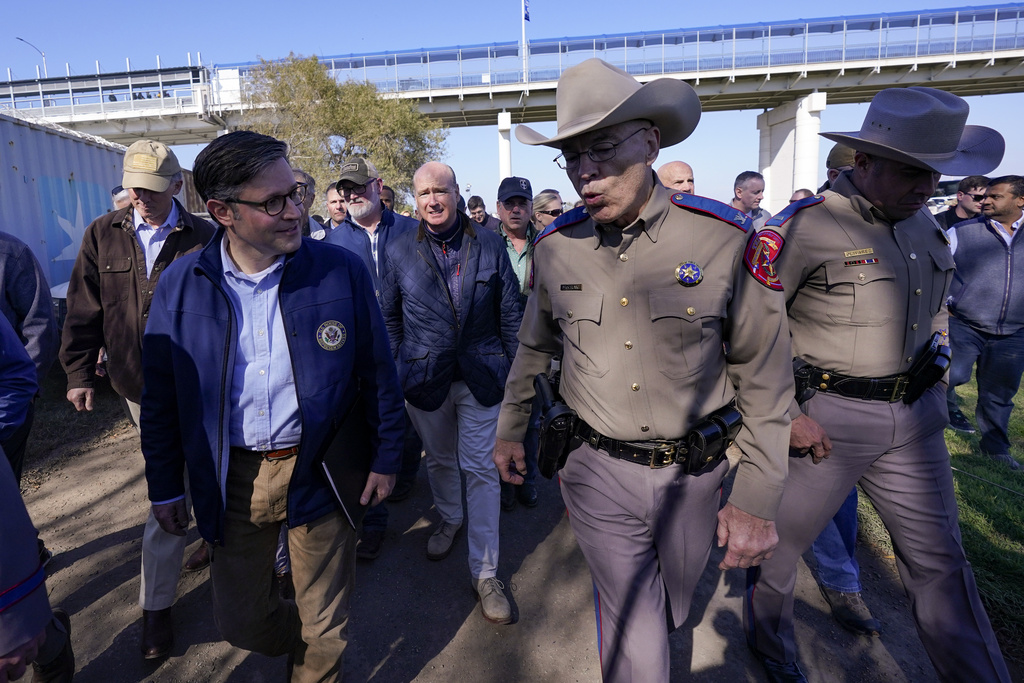 House Speaker Mike Johnson, left, walks with Texas Department of Public Safety chief Steve McCraw, center, and, Lt. Chris Olivarez, right, near the Texas-Mexico border, Wednesday, Jan. 3, 2024, in Eagle Pass, Texas. (AP Photo/Eric Gay)