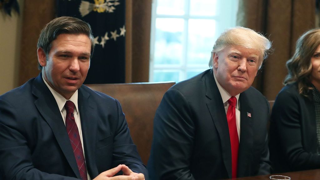Florida Governor DeSantis faces criticism from an audience member for not directly confronting Trump, who is leading in the polls.