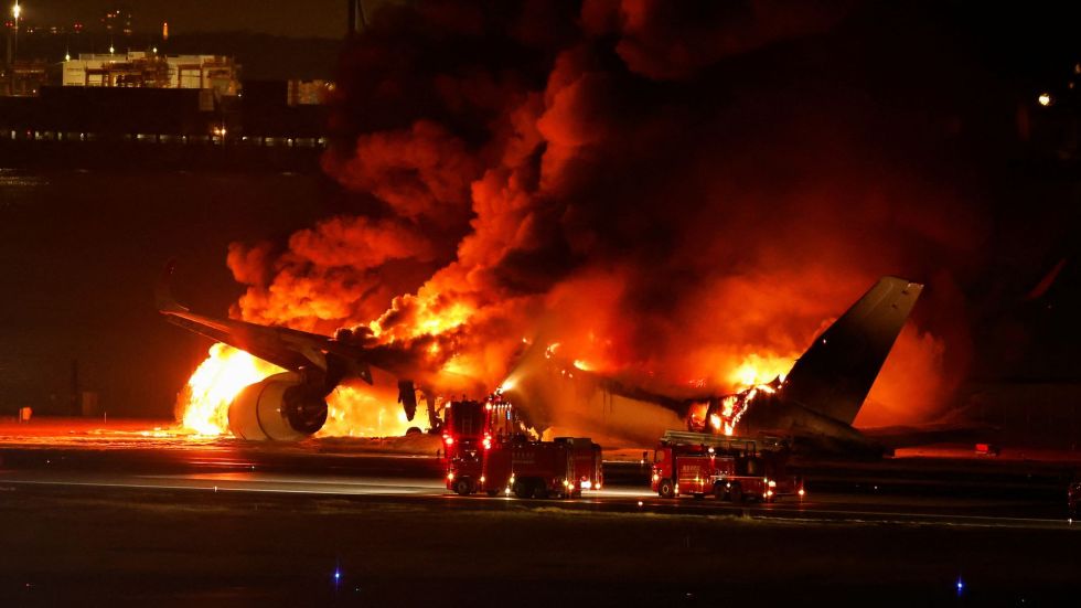 No passengers were killed after a commercial plane in Japan with nearly 400 people aboard caught fire as it skidded down the runway.