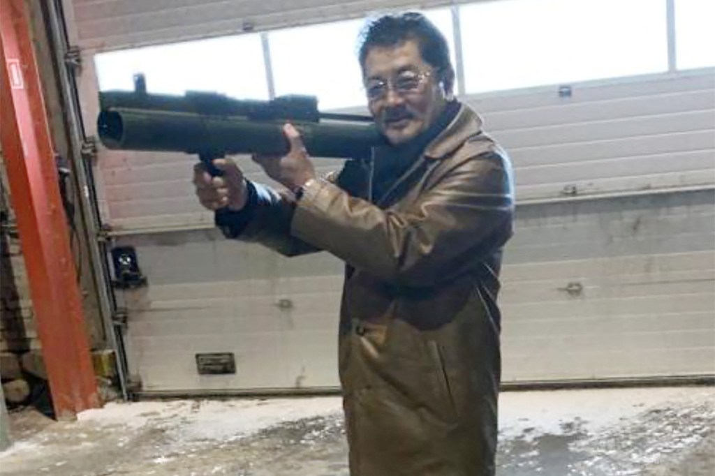 Takeshi Ebisawa poses with a rocket launcher during a meeting with an informant and two undercover Danish police officers at a warehouse in Copenhagen, Denmark February 3, 2021, in a photograph from a Drug Enforcement Administration (DEA) criminal complaint.   U.S. Magistrate Judge/Southern District of New York/Handout via REUTERS.   THIS IMAGE HAS BEEN SUPPLIED BY A THIRD PARTY. THIS IMAGE WAS PROCESSED BY REUTERS TO ENHANCE QUALITY
