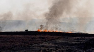 The Smokehouse Creek wildfire, now recognized as the largest in Texas history, has claimed at least two lives and crossed into Oklahoma. The Texas A&M Forest Service reports the fire is only 3% contained and has expanded to nearly 1,700 square miles after combining with another fire.