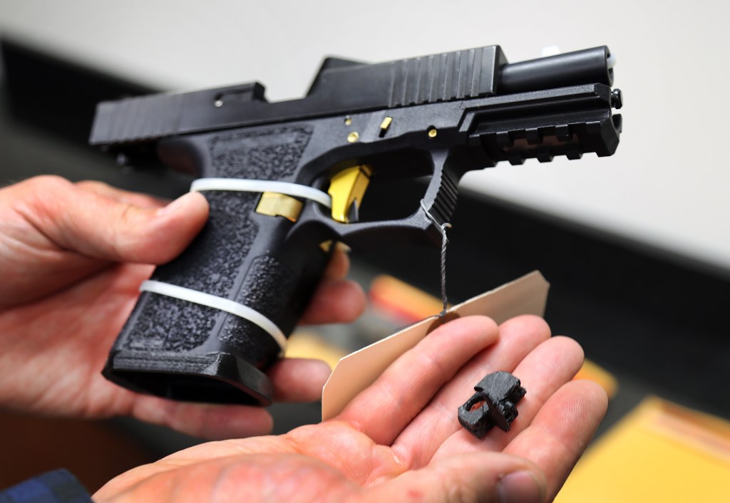 Boston, MA - September 28: A machine gun conversion device for a Glock hand gun was in custody of the ATF Boston Bureau. The device can convert the Glock into a machine gun after the "switch" is installed. It can be made with a 3-d printer. (Photo by John Tlumacki/The Boston Globe via Getty Images)