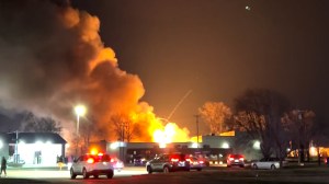 One person is dead after an industrial fire and hundreds of explosions north of Detroit sent "fireballs" and "shrapnel" into neighborhoods as far as a mile away. The fire raged for hours Monday night, launching nitrous-oxide and butane canisters into the air.