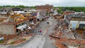 Several people, including an infant, are killed after dozens of tornadoes sweep through the Midwest and Oklahoma.