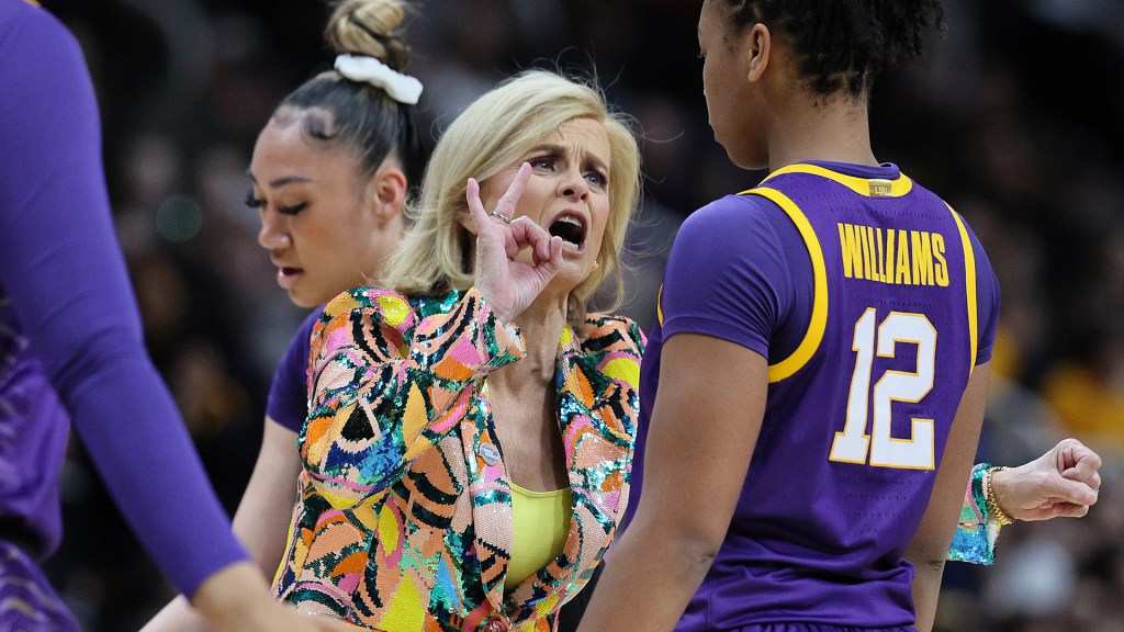 A reporter from Outkick asked LSU coach Kim Mulkey about her team not being on the floor for the National Anthem at the post-game conference.