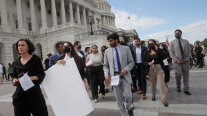 A group of congressional staff members protested on the Capitol steps as lawmakers voted on the Israel Security Assistance Support Act.