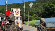North Korea escalated tensions by launching hundreds of trash and feces-filled balloons into South Korea, violating international law.