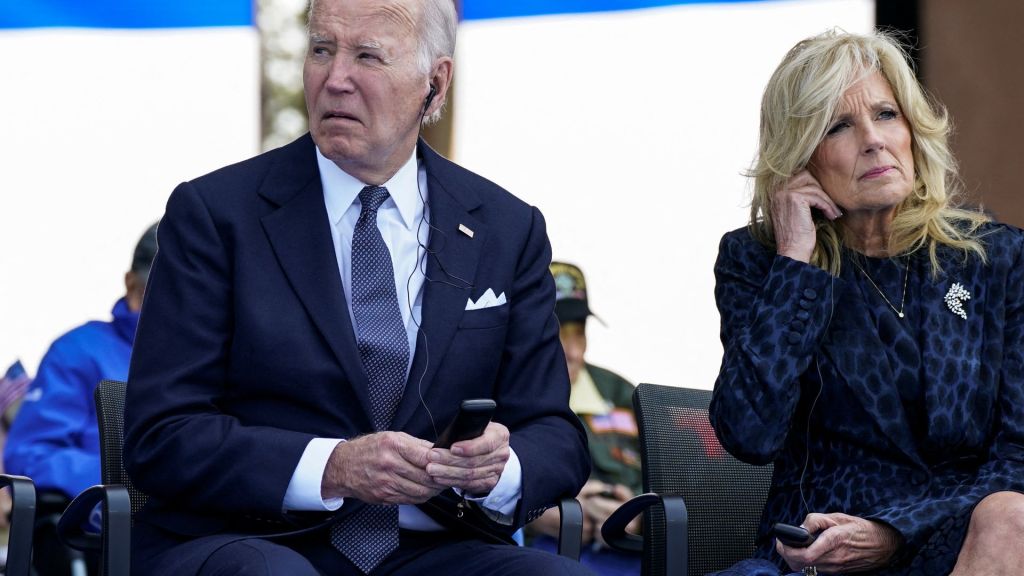 The Associated Press verified that the video showing Biden attempting to sit was doctored. Biden did sit in the chair after a brief pause.