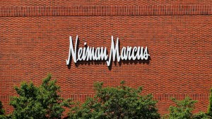 Saks Fifth Avenue's parent company acquires Neiman Marcus for $2.65 billion, forming Saks Global to boost luxury retail power.
