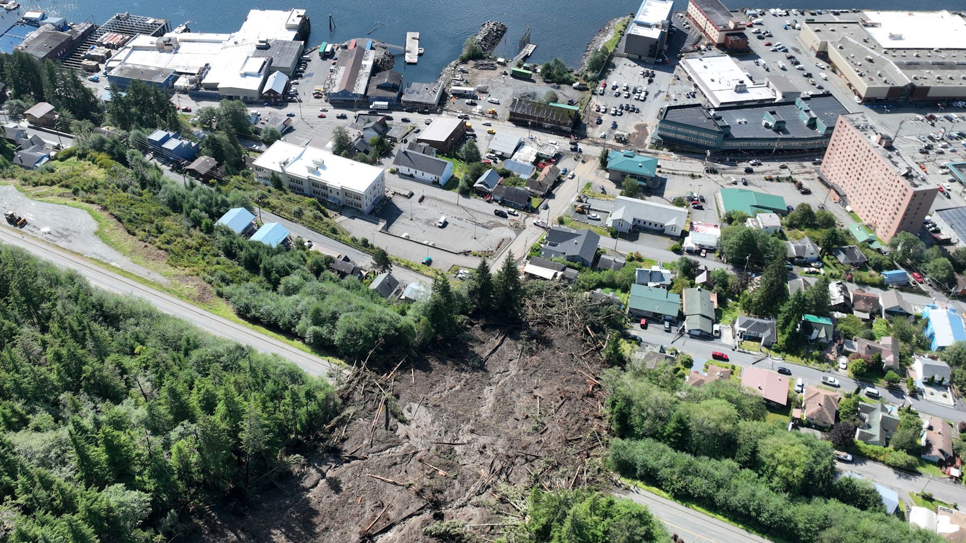 Emergency crews in Alaska assess potential landslides after one death and dozens evacuated in Ketchikan due to heavy rain.