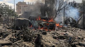 Destroyed buildings and vehicles following an Israeli airstrike in the Mawasi area of the southern Gaza Strip city of Khan Younis on July 13.