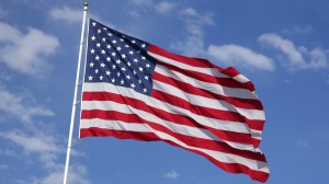 Lawmakers are calling for changes in Oklahoma over a high school student and an American flag, after a ban by the district.