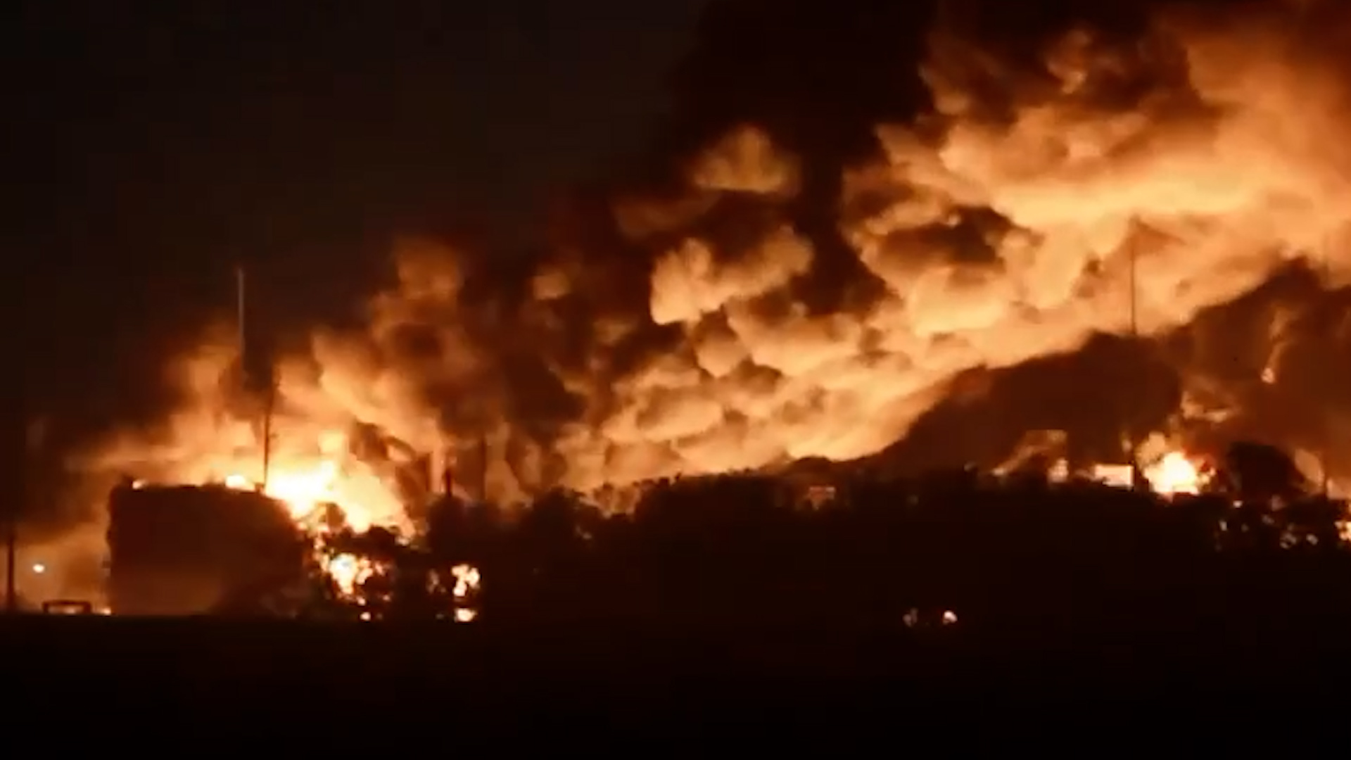 Firefighters battle a massive blaze at Russia's Kavkaz oil depot after a Ukrainian drone strike, with ongoing efforts to contain it.