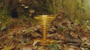 A real-life treasure hunt is underway in New England, thanks to two video game designers, with a gold sculpture hidden in the forest.