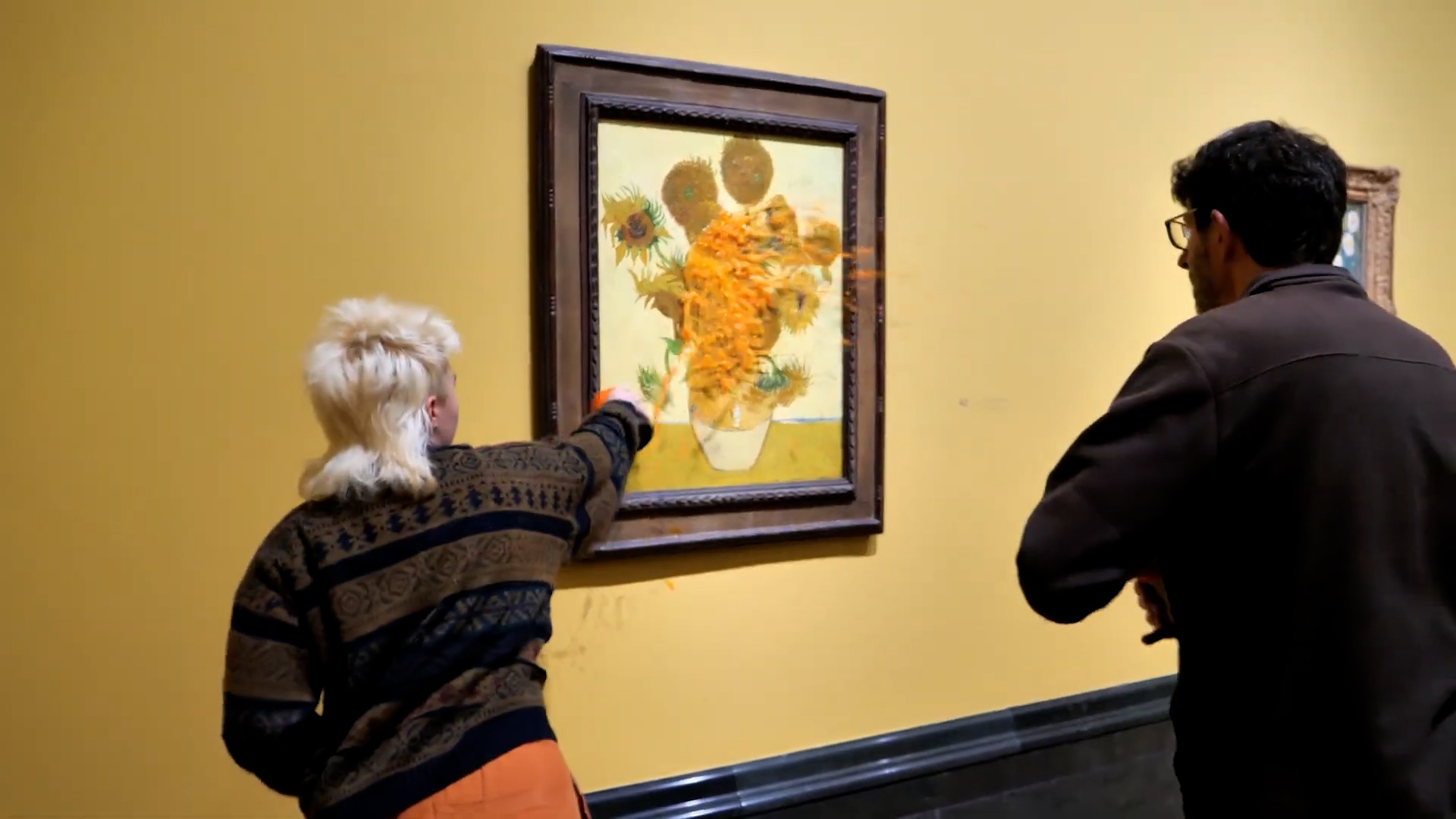 Protests from Just Stop Oil throw soup at Van Gogh painting.