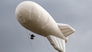 Russian blimps marked with "Z" symbol appear near Estonia's Narva border, raising concerns of Moscow's intentions.