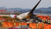 South Korea plane crash kills 179, injures 2 crew members, after Boeing 737-800 skids off runway and bursts into flames.