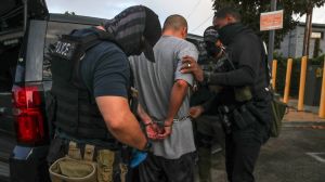 During raids, Immigration and Customs Enforcement (ICE) officials arrested hundreds of migrants illegally in the U.S.; media coverage varied.