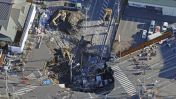 A man in Japan has been stuck in a sinkhole for days as rescuers try to figure out a way to get him out.