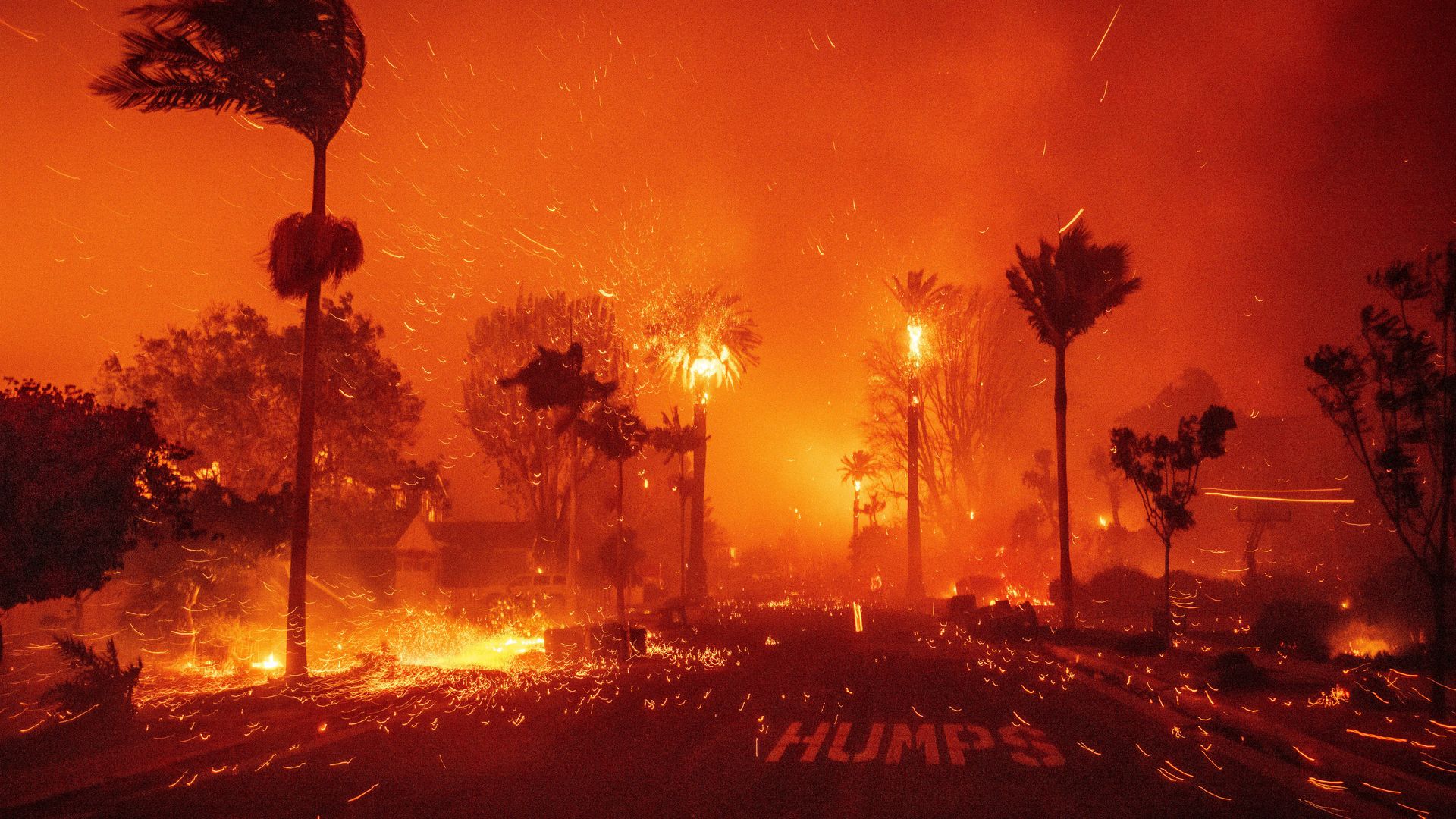 Thousands of residents are fleeing as wildfires rage across Los Angeles. Crews are battling the blazes, which have grown with strong winds.