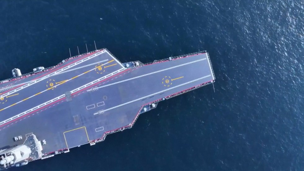 China’s military developments are under scrutiny as satellite imagery and intelligence reports reveal the construction of new amphibious landing barges and advancements in its aircraft carrier program. These developments raise concerns about Beijing’s military capabilities and intentions in the Taiwan Strait.