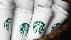 Starbucks is stirring things up with new policies like “For Here” mugs, handwritten names, and safety features.