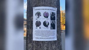 The posters are written in Spanish, and warn local residents with the message, "CAREFUL WITH THESE FACES."