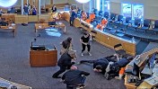 A routine court hearing in Albuquerque turned violent when three people attacked a murder defendant, setting off a chaotic brawl that was captured on courtroom surveillance footage. The altercation took place during a hearing for Alexander Ortiz, who is accused of killing his ex-girlfriend in January 2024.