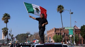 Thousands protest Trump's immigration policies in Los Angeles, blocking 101 freeway and causing gridlock, with minimal arrests reported.