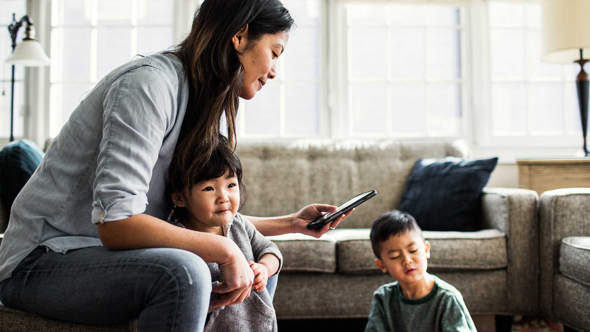 A new study shows parents who spend more time on screen-based devices expose their kids to more age-inappropriate content.