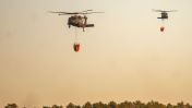 At least one brush fire continues to burn out of control on Long Island, with high wind gusts complicating firefighters' efforts Sunday.