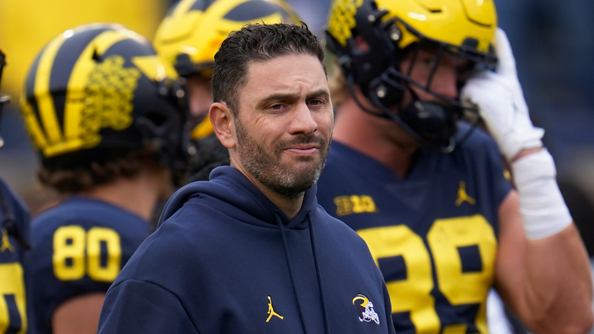 Federal prosecutors charged former University of Michigan football coach Matt Weiss with hacking into the accounts of more than 3,300 college students to access private photos and videos. A federal indictment filed in Michigan includes 14 counts of unauthorized access to computers and 10 counts of aggravated identity theft.